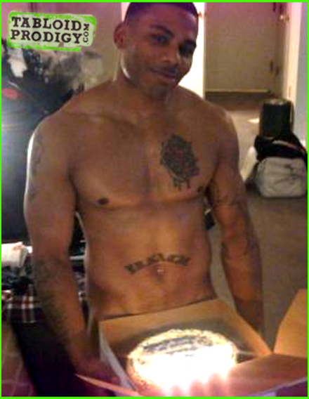 Nelly is naked and only covering himself with a birthday cake... 